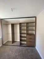 Dark Brown Charleston Oak wardrobe using the alcove for hanging and drawers and shelving for the shallower area, fitted in Bowburn